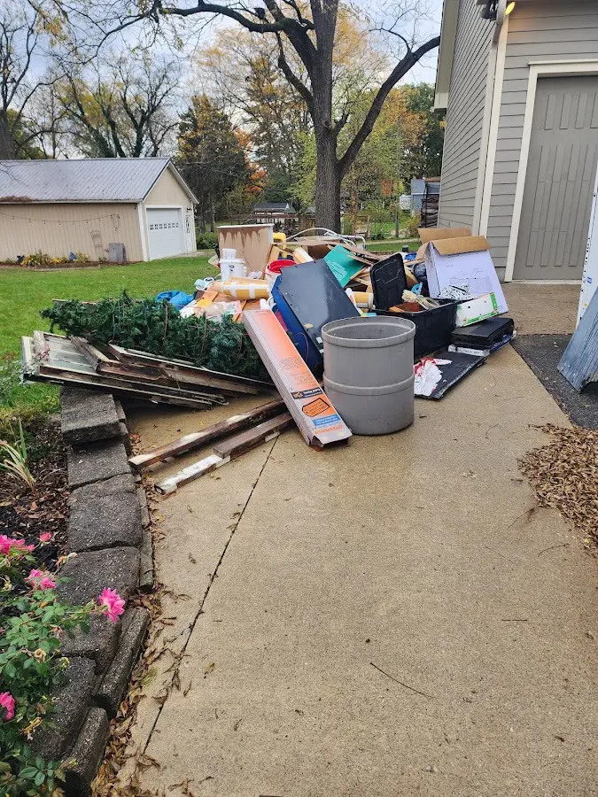 Dumpster being loaded with debris for Demolition Dumpster Rental in West Mifflin